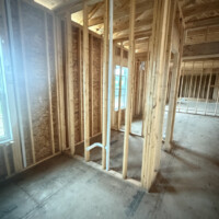 1694D6D0 1BCE 4555 A3BC 7E833D7CD871 bf4cd57d a213 4bfd acf5 be5d619fcc1a Framed partition wall showing vertical waste stack and horizontal branch arm for plumbing fixtures.