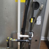 498fc7ae fa89 4993 a859 e296c5888f33 71c74cd9 30bf 4115 98c7 6bb2b3e5ccdd Furnace gas connection featuring a 3/4" to 1/2" reducer, a blue-handled ball valve, and a vertical sediment trap assembly.