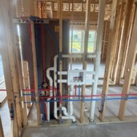 ReactNativeBlobUtilTmp b3u9mmxo9sfwbq68i9s4pl Wall-mounted laundry outlet box with color-coded PEX supply lines and Delta shower valve rough-in Springfield KY