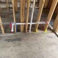 ReactNativeBlobUtilTmp tj5ux62ugkuoypjklti9 Double vanity plumbing rough-in with sanitary tee connection and secured PEX supply lines.