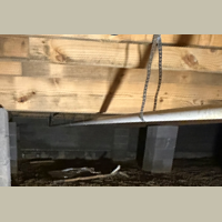 Screenshot 2026 07 25 070821 Clean PVC drain and vent piping assembly connected underneath a new home subfloor.