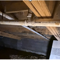 Screenshot 2026 07 25 074721 Cleanly aligned long-run waste pipe section installed along floor joists in Crab Orchard crawlspace.