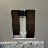 ReactNativeBlobUtilTmp 9ie38kdqkboagrgiy8jxjq Clean repair of vertical PVC vent stack using a shielded Fernco coupling and new 3x1-1/2 inch sanitary tee.