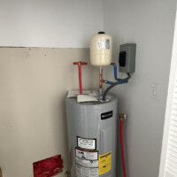 ReactNativeBlobUtilTmp b1yhc8lj2ru8vtwq0i4utl Newly installed Reliance electric water heater with top-mounted thermal expansion tank, press fittings, and PEX supply lines in Berea, KY.