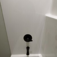 ReactNativeBlobUtilTmp n0nvwrdg47qgog4rb3kz Oil-rubbed bronze lavatory faucet trim detail on a solid surface vanity top.