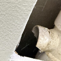 ReactNativeBlobUtilTmp rvy8my2e2he1a09vo2r5 Close-up view of the sheared PVC pipe branch joint prior to removal and replacement.