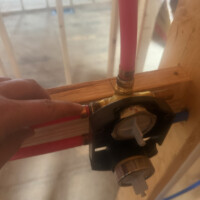 ReactNativeBlobUtilTmp tnf7dkwqtlbxhtbrf77n0i PEX water lines neatly routed through open wall studs and overhead ceiling joists alongside sheet metal ducting.