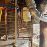 ReactNativeBlobUtilTmp uodwth61s7qb84nmv1hfsp Water heater setup featuring copper supply lines, shut-off valve, and thermal expansion tank installation.